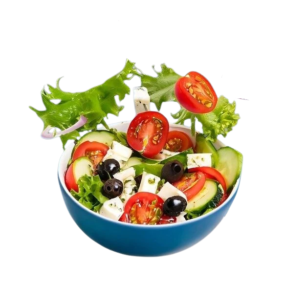Salad tossed above a bowl at SLYCE Pizza Cafe